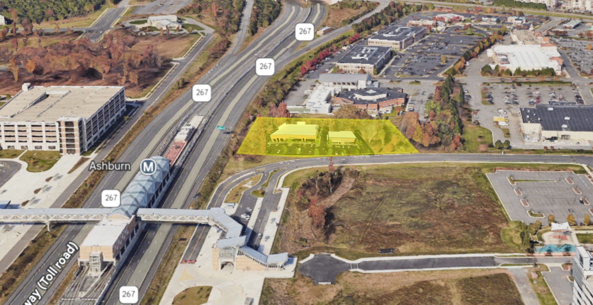 Overhead view of a prime development site near Ashburn Metro Station in Loudoun County, VA, featuring a proposed automotive service station and drive-thru restaurant with easy access to major transit routes and nearby residential developments.