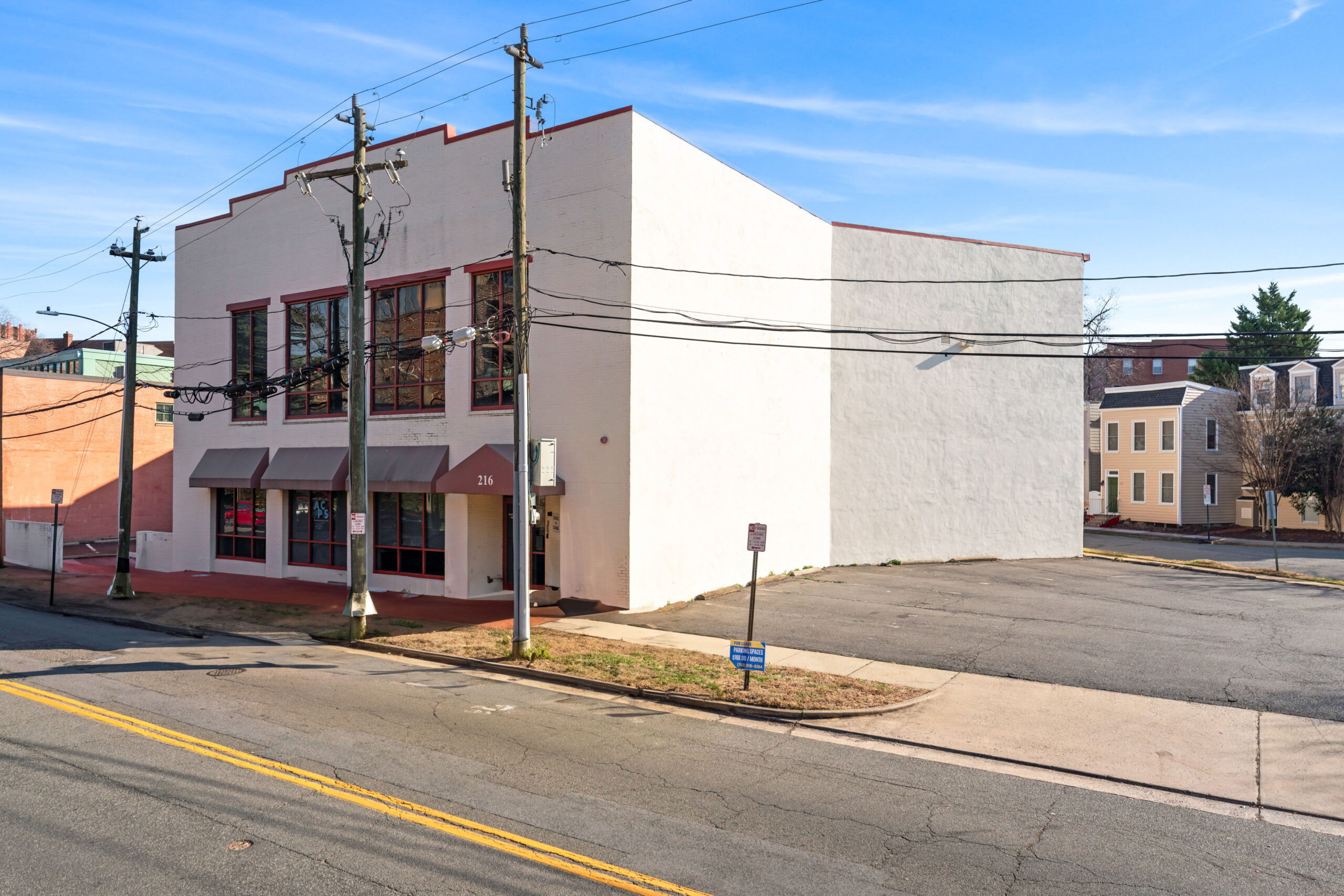 Exterior view of 216 S Peyton Street, a two-story commercial building with private parking in Old Town Alexandria, VA, sold by Serafin Real Estate.