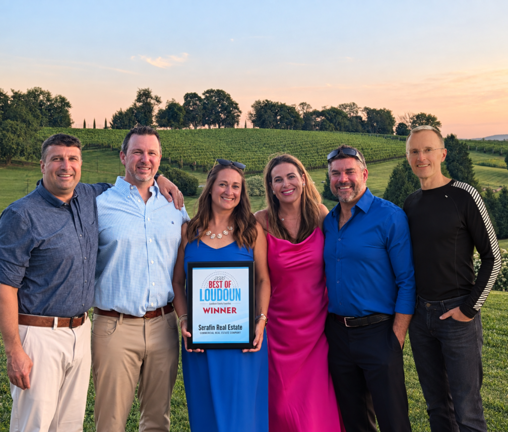 Serafin Real Estate commercial brokerage team holding their Best of Loudoun winner award in Loudoun County, Virginia